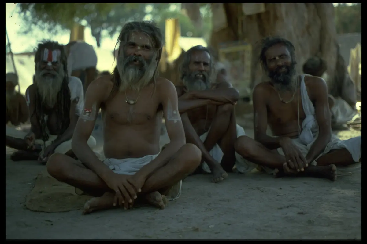 Four sadhus seated under tree