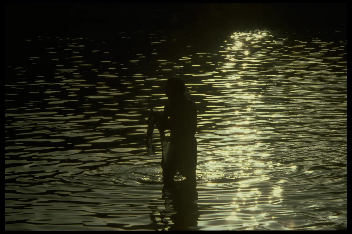 Fisherman silhouette water