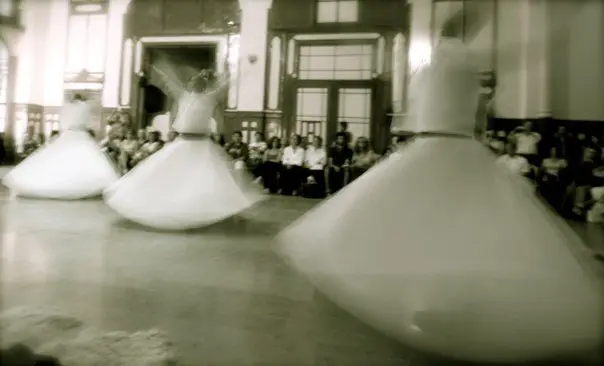 Sufi whirling dervishes in ceremony